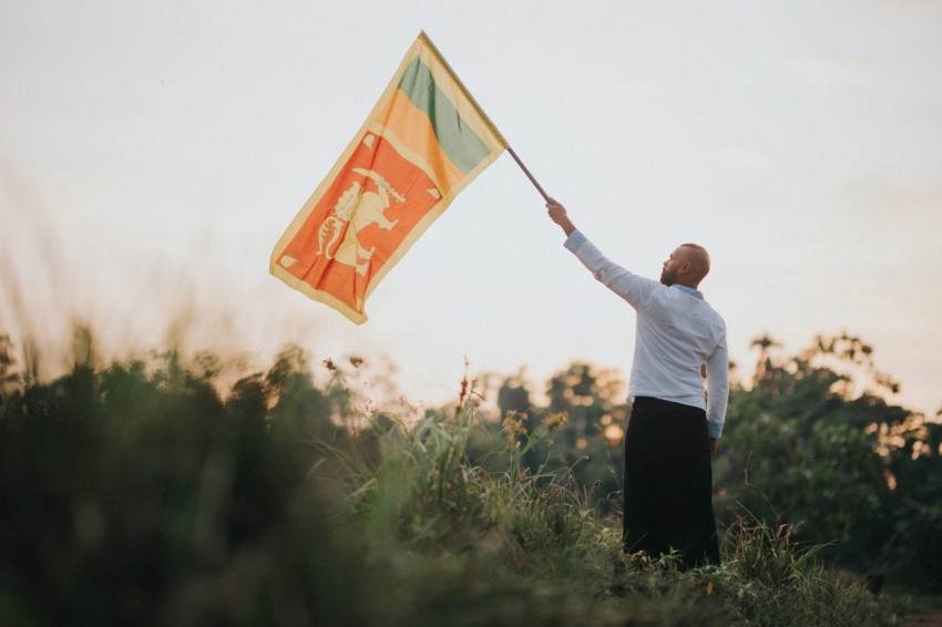 Man Waving Sri Lanka National Flag Sinha Kodiya Jathika Kodiya  (101)