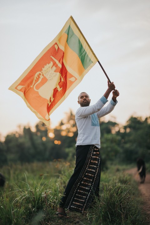 Man Waving Sri Lanka National Flag Sinha Kodiya Jathika Kodiya  (84)
