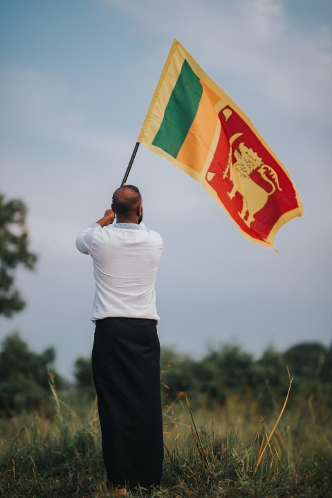 Man Waving Sri Lanka National Flag Sinha Kodiya Jathika Kodiya  (121)