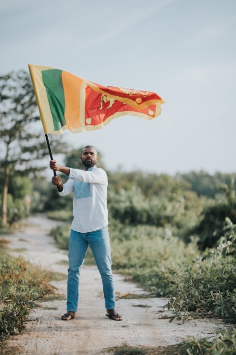 Man Waving Sri Lanka National Flag Sinha Kodiya Jathika Kodiya  (2)