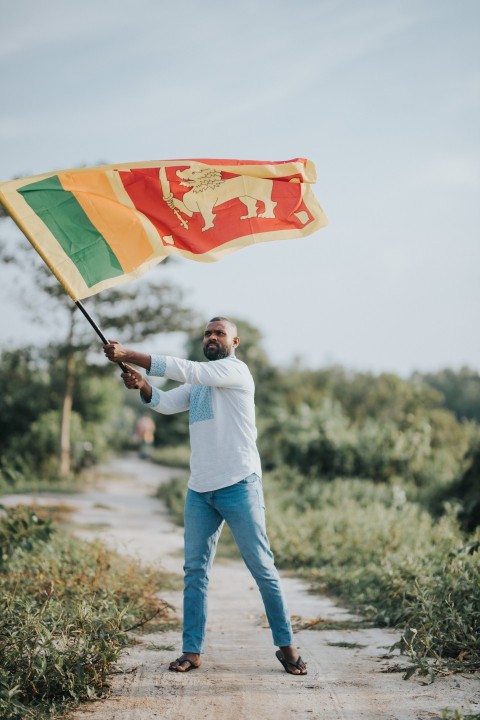 Man Waving Sri Lanka National Flag Sinha Kodiya Jathika Kodiya  (4)