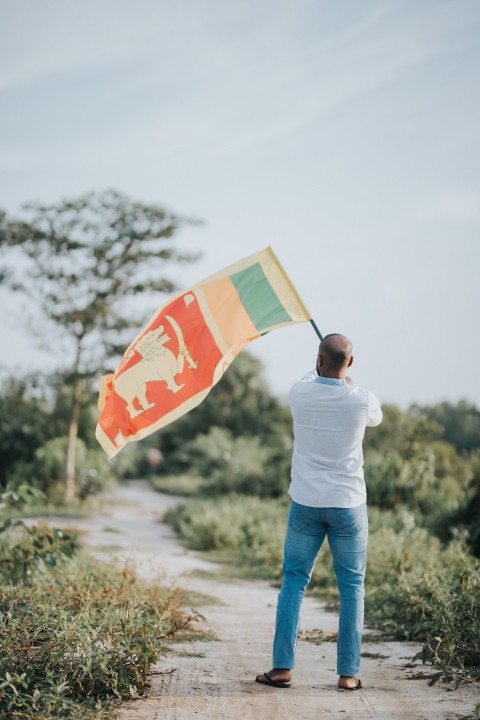 Man Waving Sri Lanka National Flag Sinha Kodiya Jathika Kodiya  (6)
