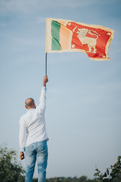 Man Waving Sri Lanka National Flag Sinha Kodiya Jathika Kodiya  (26)