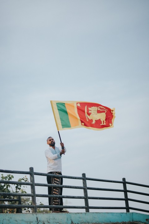 Man Waving Sri Lanka National Flag Sinha Kodiya Jathika Kodiya  (30)