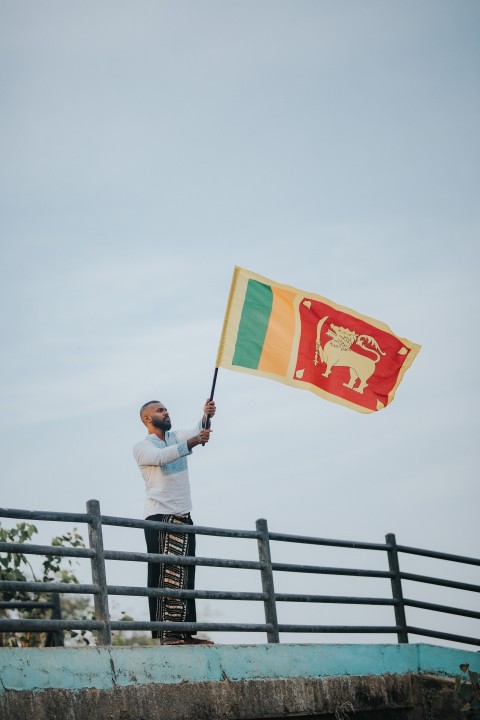 Man Waving Sri Lanka National Flag Sinha Kodiya Jathika Kodiya  (31)