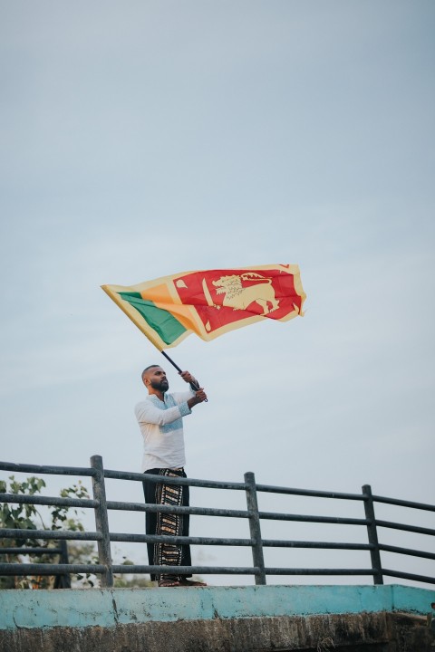 Man Waving Sri Lanka National Flag Sinha Kodiya Jathika Kodiya  (32)
