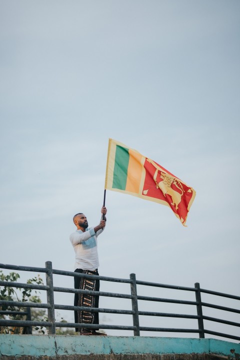 Man Waving Sri Lanka National Flag Sinha Kodiya Jathika Kodiya  (34)