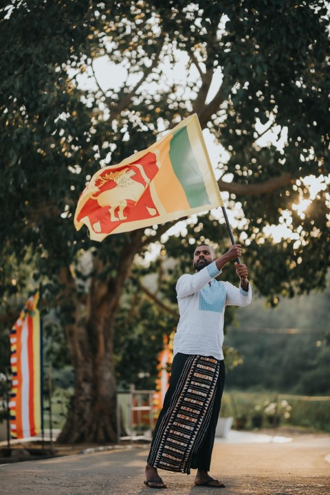 Man Waving Sri Lanka National Flag Sinha Kodiya Jathika Kodiya  (36)