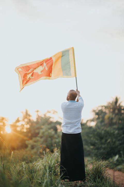 Man Waving Sri Lanka National Flag Sinha Kodiya Jathika Kodiya  (56)