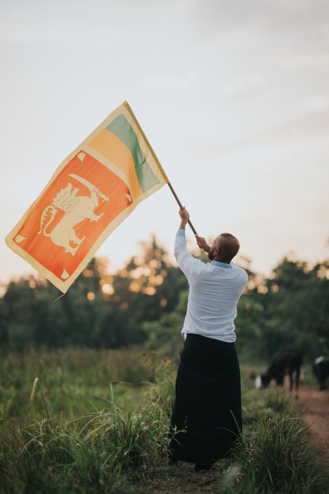 Man Waving Sri Lanka National Flag Sinha Kodiya Jathika Kodiya  (93)