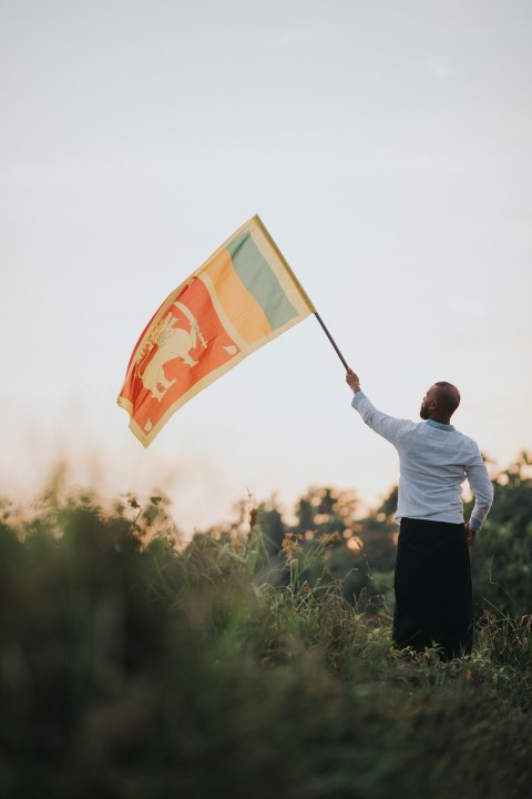 Man Waving Sri Lanka National Flag Sinha Kodiya Jathika Kodiya  (104)