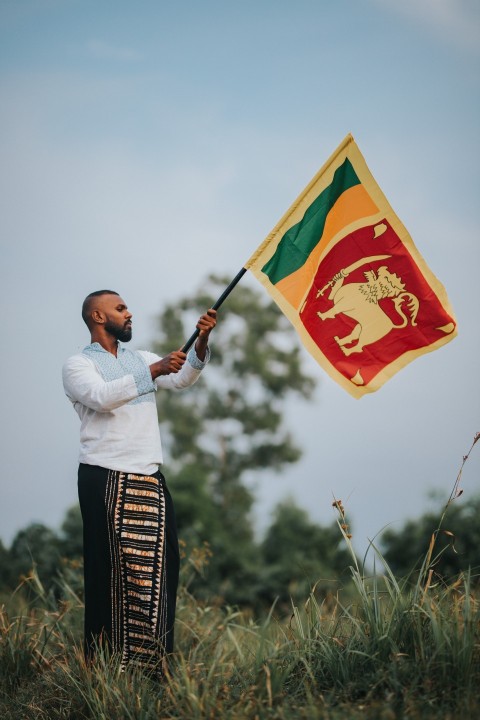 Man Waving Sri Lanka National Flag Sinha Kodiya Jathika Kodiya  (114)