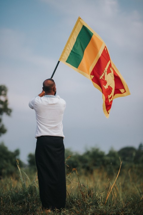 Man Waving Sri Lanka National Flag Sinha Kodiya Jathika Kodiya  (120)