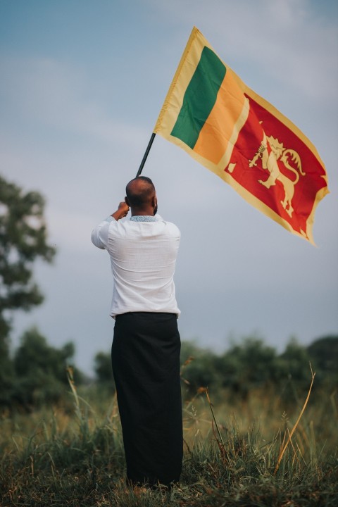 Man Waving Sri Lanka National Flag Sinha Kodiya Jathika Kodiya  (122)