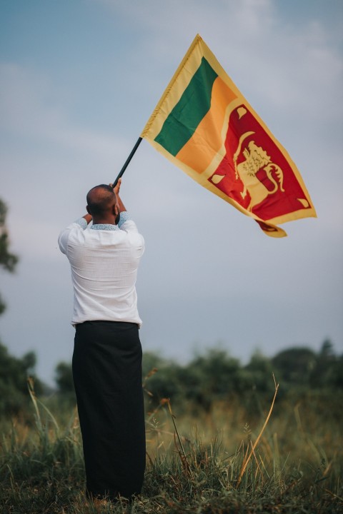 Man Waving Sri Lanka National Flag Sinha Kodiya Jathika Kodiya  (123)