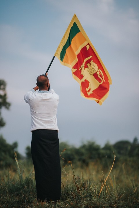Man Waving Sri Lanka National Flag Sinha Kodiya Jathika Kodiya  (124)