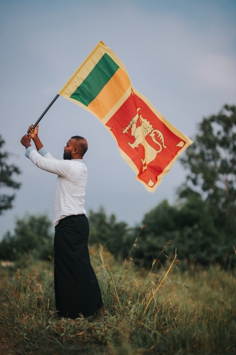 Man Waving Sri Lanka National Flag Sinha Kodiya Jathika Kodiya  (126)