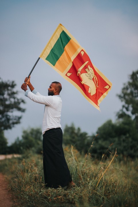 Man Waving Sri Lanka National Flag Sinha Kodiya Jathika Kodiya  (127)